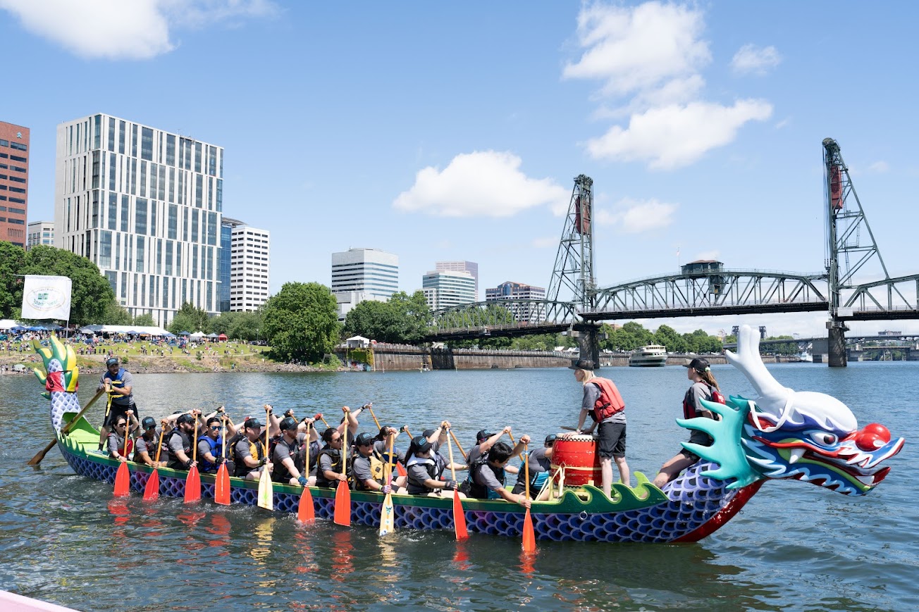 A Traditional-Style Dragon Boat fully loaded near the dock.