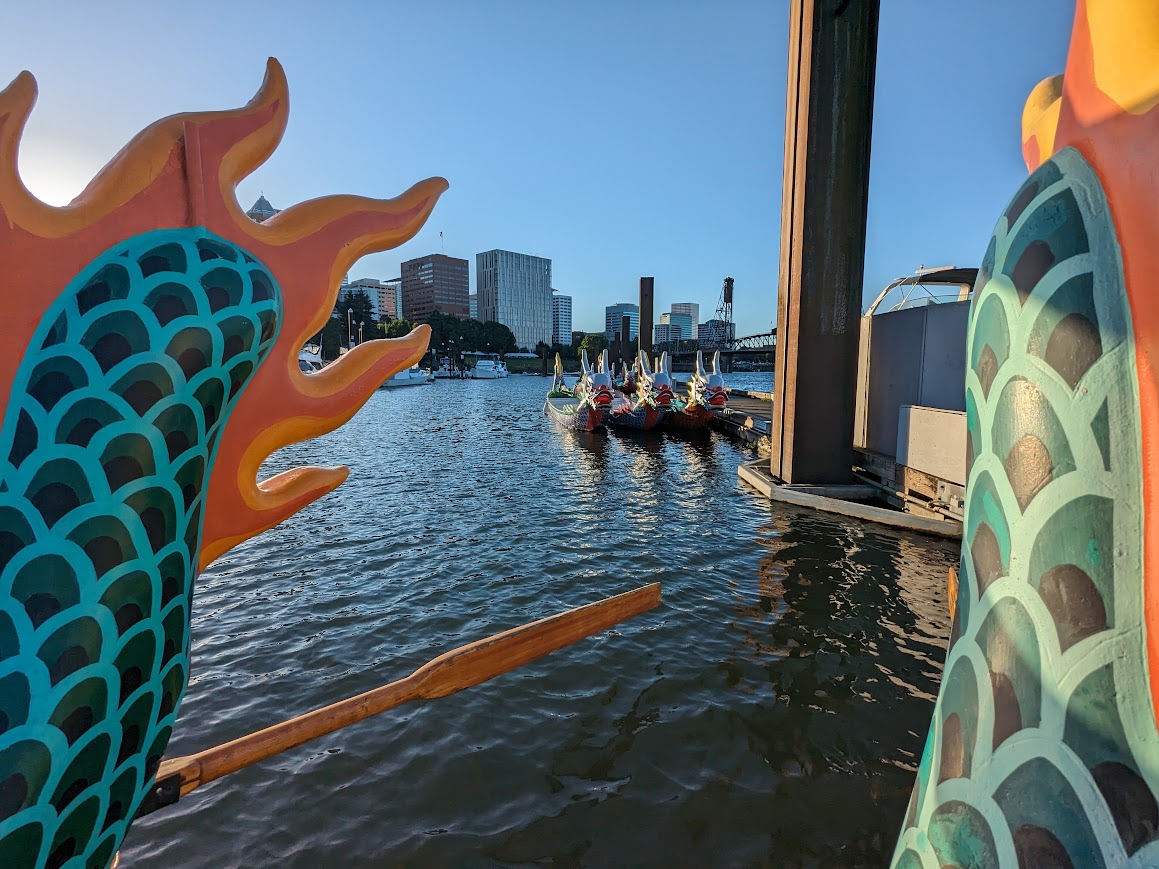 Traditional-Style Dragon Boats. View From end of boat with tail and more boats in the distance.