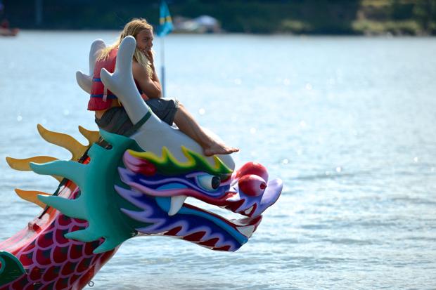 A Flag Catcher sitting on the Dragon's head of our Traditional-Style Dragon Boats. Local Teams may practice when the practice buoy is available.
